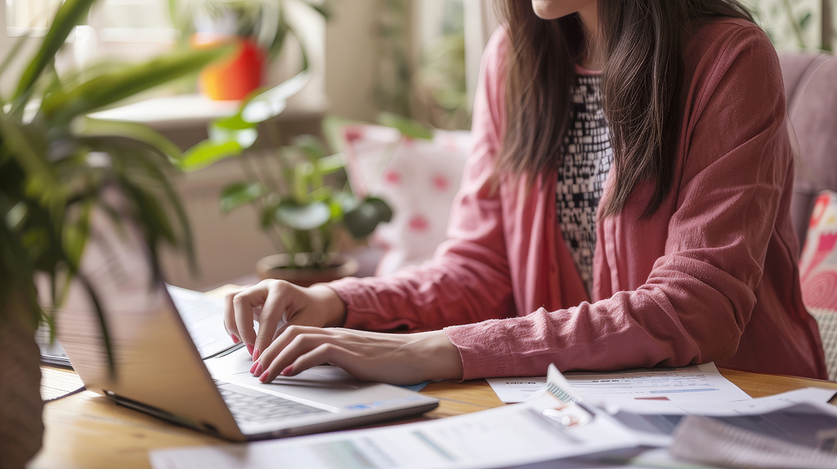 Business owner using a laptop with licensing resources open on the screen, illustrating tools available to simplify licensing processes.