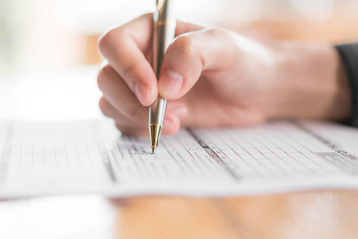 Checklist with items marked off, symbolizing the process of determining business licenses and permits for compliance.